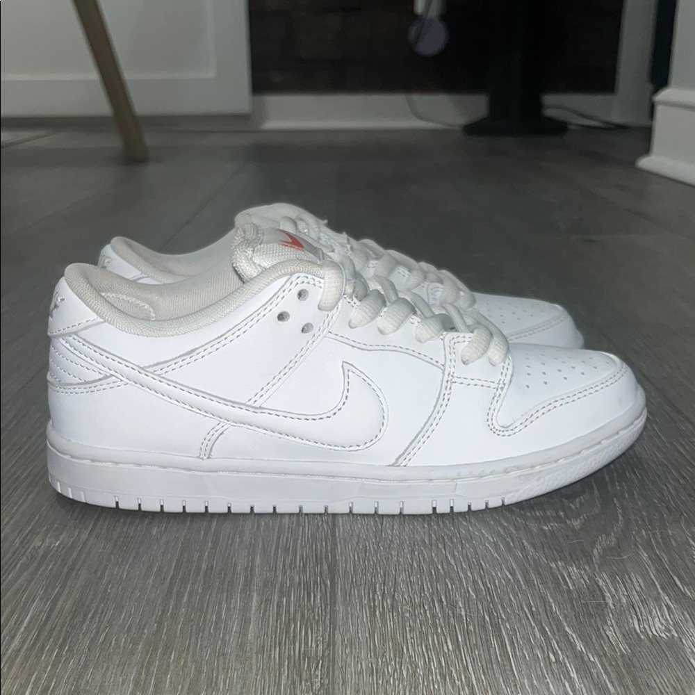 Nike SB dunk low triple white. Brand new without box!  Size 7 women's/ 5.5 youth